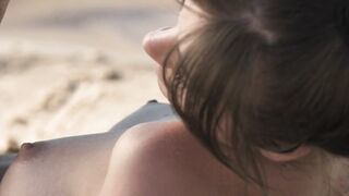 Exotic cutie Natalia playing on a sandy beach