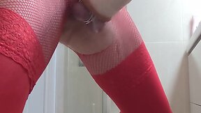 Crossdresser in red fetish outfit pumps out delicious multiple cum loads