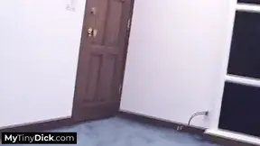 A hot brunette tattooed temptress sucking his small cock