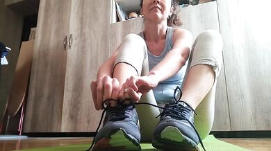 Sweaty feet after workout. Stinky socks and sneakers.Sniffing - OlgaNovem