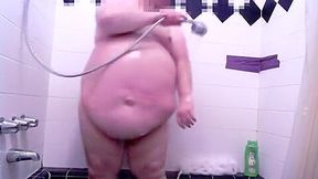 Fat guy taking a shower