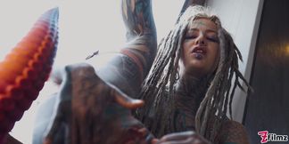 Gorgeous tattooed girl fucks her ass with a big dildo