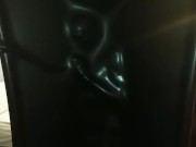 Slave encased in latex vacuum tower