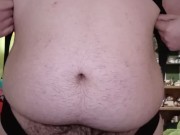 Fat guy wearing bodysuit strips and cums