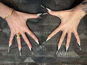 The new nail shape is even longer, sharp stilettos, long fingers, cream hands, jewelry