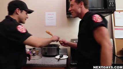 Andrew leans on the kitchen counter while Justin pounds him