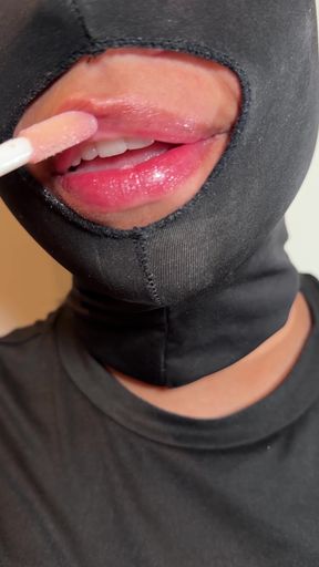 Slowly putting gloss on my lips… look how shiny and juicy they got.