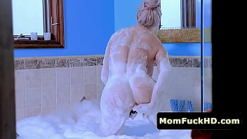 Slutty stepmom gets a big cock in the shower