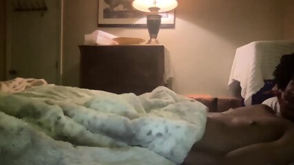 interracial couple in bed on cam