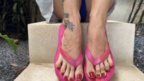 Pink flip flops on my pretty feet with long toes in Outdoor , red toenails polish