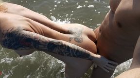 Fit blonde babe with big ass fucks on a public nude beach