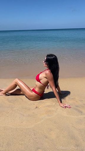 Teasing in Red Bikini on the Beach