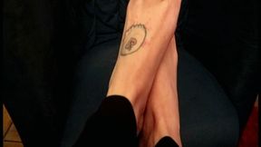 TF unwraps a chocolate bar and pours some water with her feet