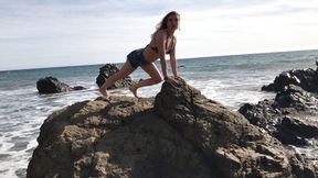 Model blows on the beach