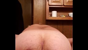 Inserting my black rubber butt plug.