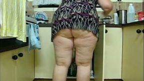Bootylicious flabby bitch poses on webcam in the kitchen