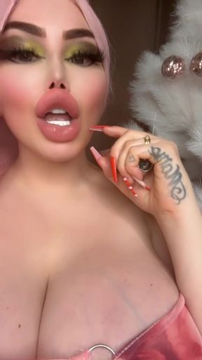Miss Bimbo big tits sucks dildo