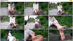 He approached Ling Zi, a beautiful and mature woman, on the street. She sat on a street chair and boldly displayed her weathered, large feet.