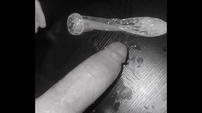 Jerking off a big dick in a condom