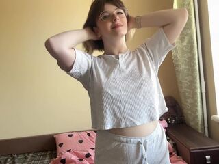 Charming brunette gracefully swaying her hips, showing off her appetizing forms.