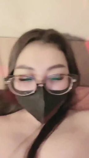 Teen playing dildo on the bed