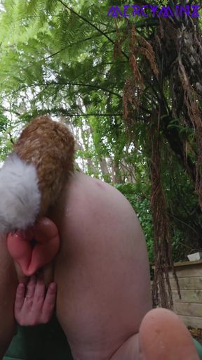 Solo girl plays with butt plugs in petplay outfit