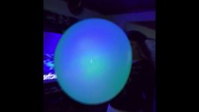 Blowing a Green Wubble at night