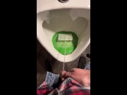 Pissing into a urinal in a pub. I play football with urine