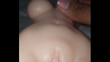A doll with a small body and big tits gets fucked by a big black cock in her vagina and ass. I give her a creampie in her small vagina.