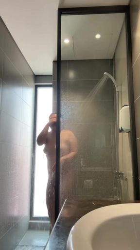Showering petite teen with big tits goes nude