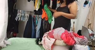 Housewife While She Cleans the Room and Folds and Hangs the Clothes