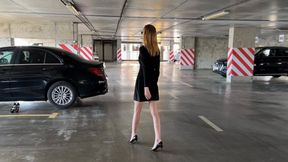 a girl in high-heeled shoes presses the pedals of the car, she changes her shoes and continues to play with the pedals