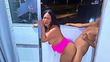 Latina slut fucking and sucking cock on a balcony overlooking the public street in Medellin, a wet blowjob and a frenetic fuck. While she is being fucked the cars pass by on the road. Venezuelan bitch