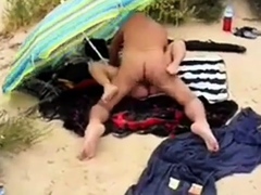 His girl with stranger at the beach