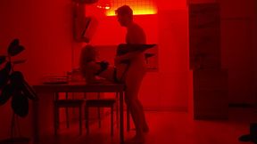Romantic couple sex under red neon