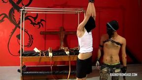 Masked Damien is bound and flogged by master Ryann