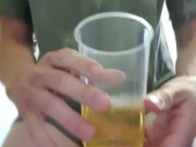 Sissy drinking own piss from cup.