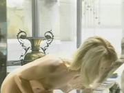 The blonde milf enjoys her eager pussy alone in the tub