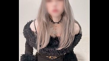 Belle, a femboy dressed as a girl in a black dress