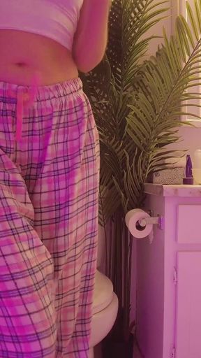 Emily pissing in the bathroom