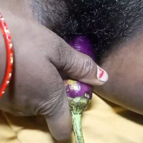 Neetu bhabhi Put Brinjal In his Huge Pussy . And masturbating herself.