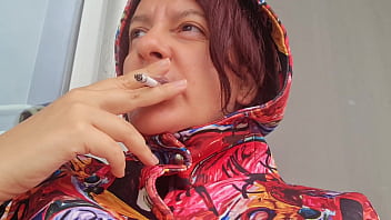 Smoking cigarette on a rainy day outside the bar