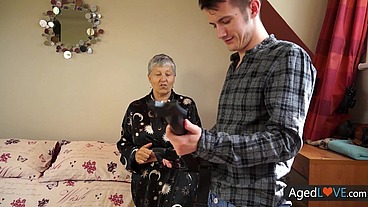 Granny Savana enjoys the hot ride on Sam's young cock AGEDLOVE