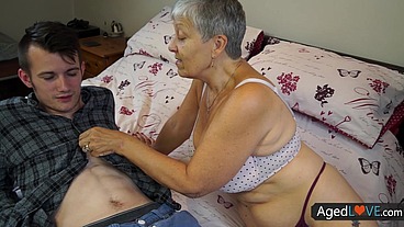 Granny Savana enjoys the hot ride on Sam's young cock AGEDLOVE