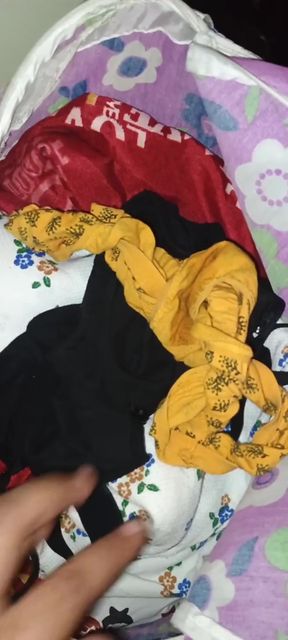 Woman sniffs her own panties while wearing a bra