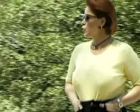 Busty German woman showing her moves outdoors