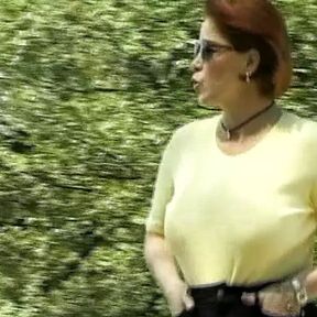 Busty German woman showing her moves outdoors