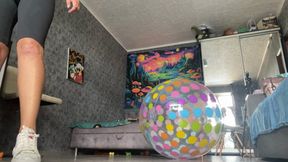 Valeri riding on intex beachball in room