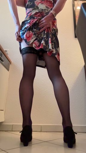 Secretary in floral dress pampering herself in coffee kitchen