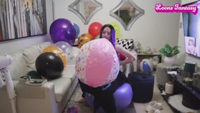 Blowing up pink beach ball and bouncing on yoga ball